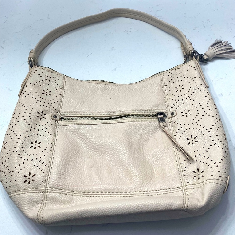 The Sak off-white woman’s Shoulder Purse with cool design.